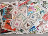 a bag full of stamps sitting on a table