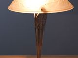 a lamp that is sitting on a wooden table
