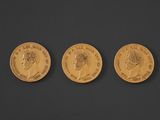 three gold sovereigns, one of which is a sovereign and the other of which is a sovereign