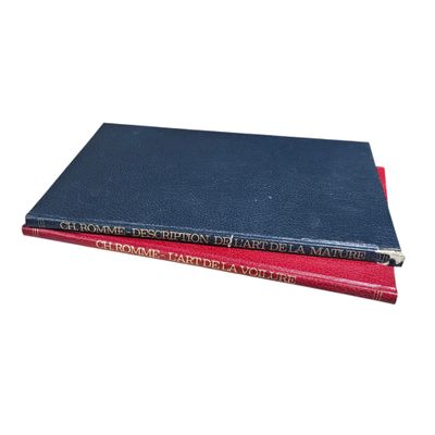 two books sitting on top of each other on a white surface