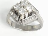 an image of a three stone diamond ring on a white background