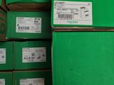 several boxes of green boxes are stacked on top of each other