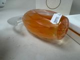 a bottle of honey sitting on a counter next to a box