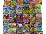 a pile of pokemon cards sitting on top of each other