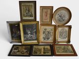 a lot of framed pictures on a white surface