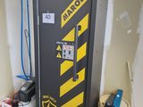a black and yellow locker with a sign on it