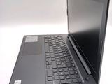 a laptop computer sitting on top of a white table
