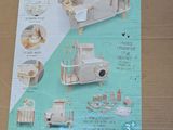 a cardboard box with a picture of a wooden toy boat