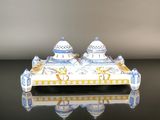 a picture of a ceramic salt and pepper shaker on a table