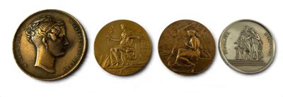 four different types of coins are shown on a white surface