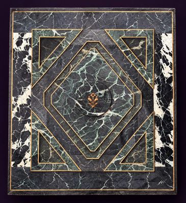 an image of a black and white marble tile with gold trimming
