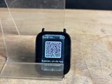 a smart watch with a qr code on the screen