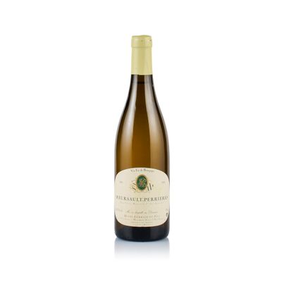 the bottle of white wine is sitting on a white surface