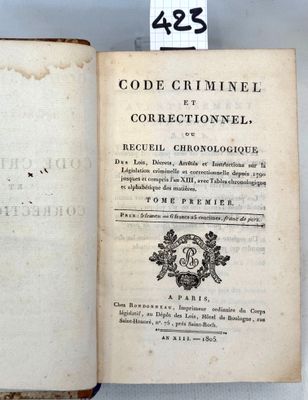 an old book that is open on a table