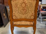 a chair that is sitting in the middle of a room