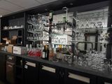 a bar with a lot of wine glasses on it