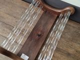 a wooden table with a glass display on it