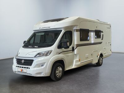 an image of a white motorhome parked in a room