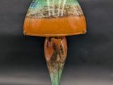 an image of a lamp with a green base and a brown base