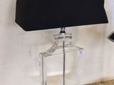 a lamp that is sitting on a table next to a lamp