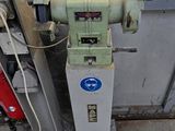 a machine that is sitting on the side of a building