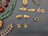 several different types of jewelry are displayed on a table