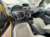the interior of a small car with a steering wheel and dashboard