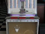 un juke-box posé sur un sol à carreaux noirs et blancs