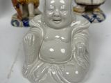 two figurines that are sitting next to each other