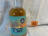 a bottle of rum that is sitting on a white sheet