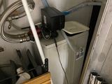 an image of a bathroom with a toilet and a water heater