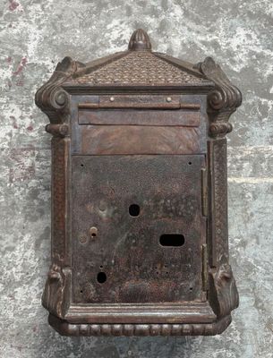 an old metal mail box on the wall