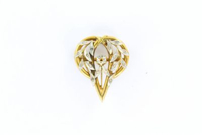 une image d'une broche en or et diamants