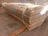 several pieces of wood are stacked on top of each other in a pile
