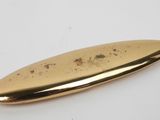 an image of a gold colored surfboard on a white surface