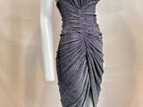 the mannequin is wearing a gray dress with a halt