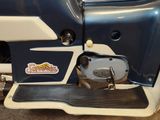 a close up of a motor bike with a blue and white body