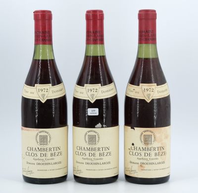 three bottles of wine sitting next to each other on a table