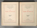 pair of books on a gray table with a red border