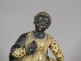 a statue of a woman holding a basket of flowers