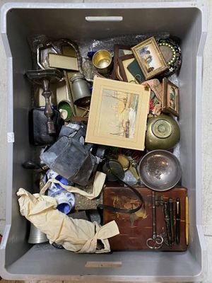 a box full of assorted items sitting on the floor