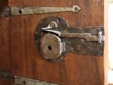 a wooden cabinet with a lock on the front of it