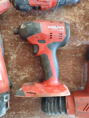three electric tools that are sitting on a table