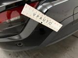 a sticker on the back of a car that has a sticker attached to it