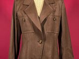 a brown jacket on a mannequin mannequin mannequin mannequin mannequin mannequin mannequin mannequin mannequin