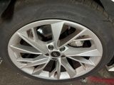a close up of a tire on a car ' s rim