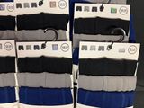 many pairs of men ' s socks on display in the store