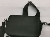 a black purse with a chain hanging from it
