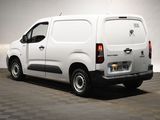 a picture of a white van parked in a garage