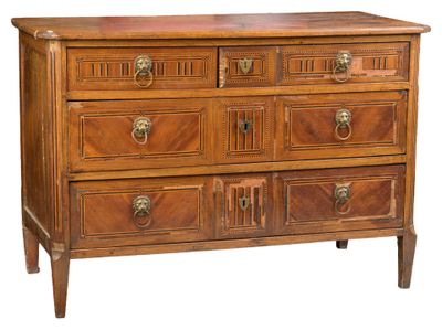a wooden chest of drawers with brass knobs on each drawer